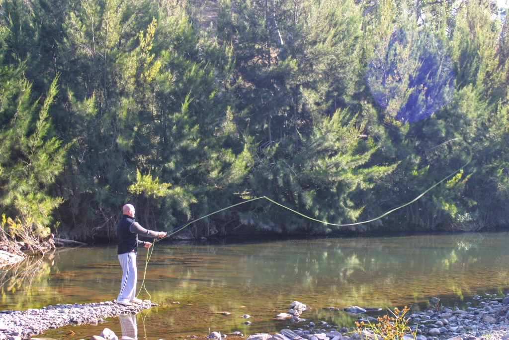 Casting a fly into trout water!